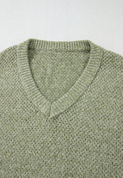 Matcha green open-knit slouchy V-neck sweater with ribbed trim.