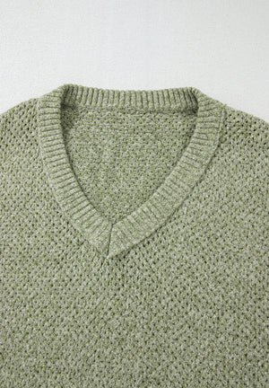 Matcha green open-knit slouchy V-neck sweater with ribbed trim.