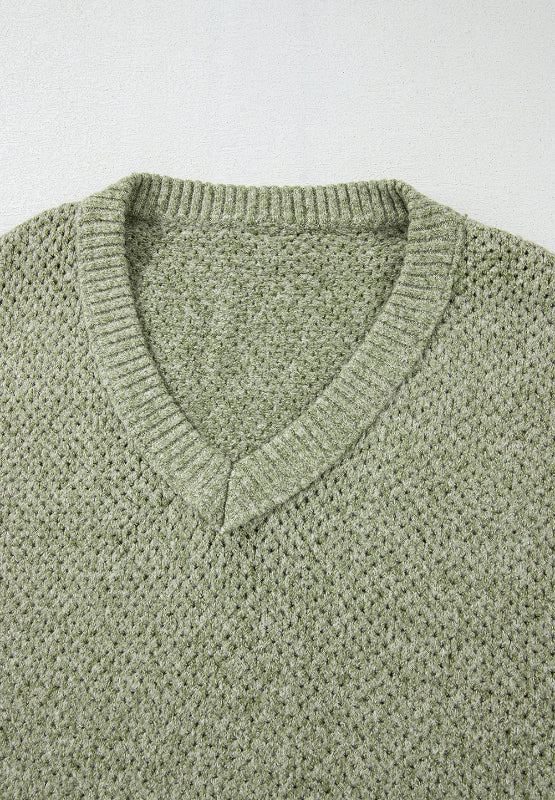 Matcha green open-knit slouchy V-neck sweater with ribbed trim.