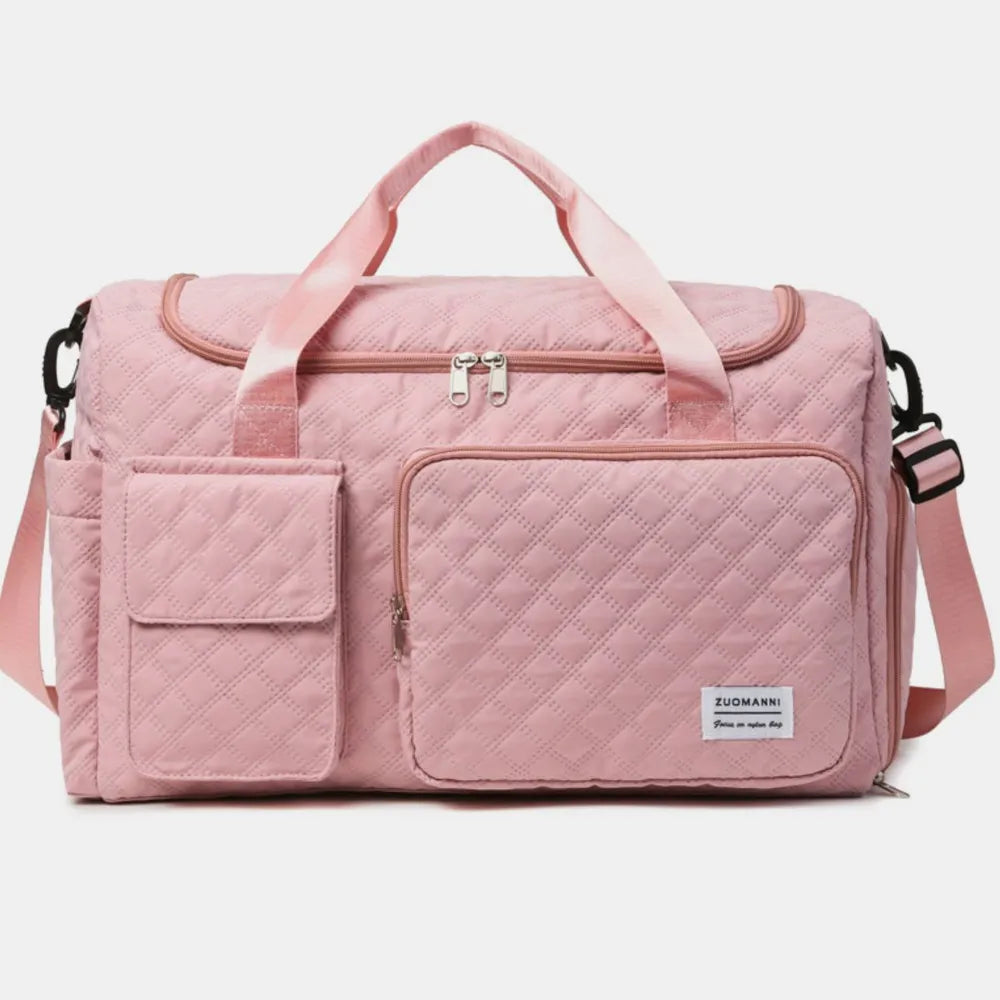 Quilted duffel bag in Dusty Pink with multiple pockets and olive accents.
