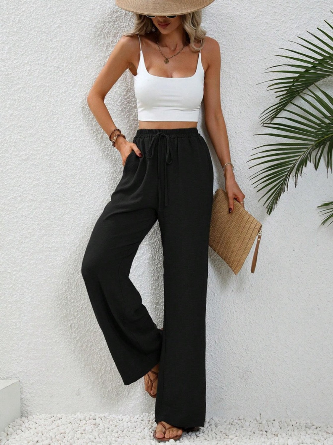 Black textured palazzo trousers with drawstring waist and wide leg