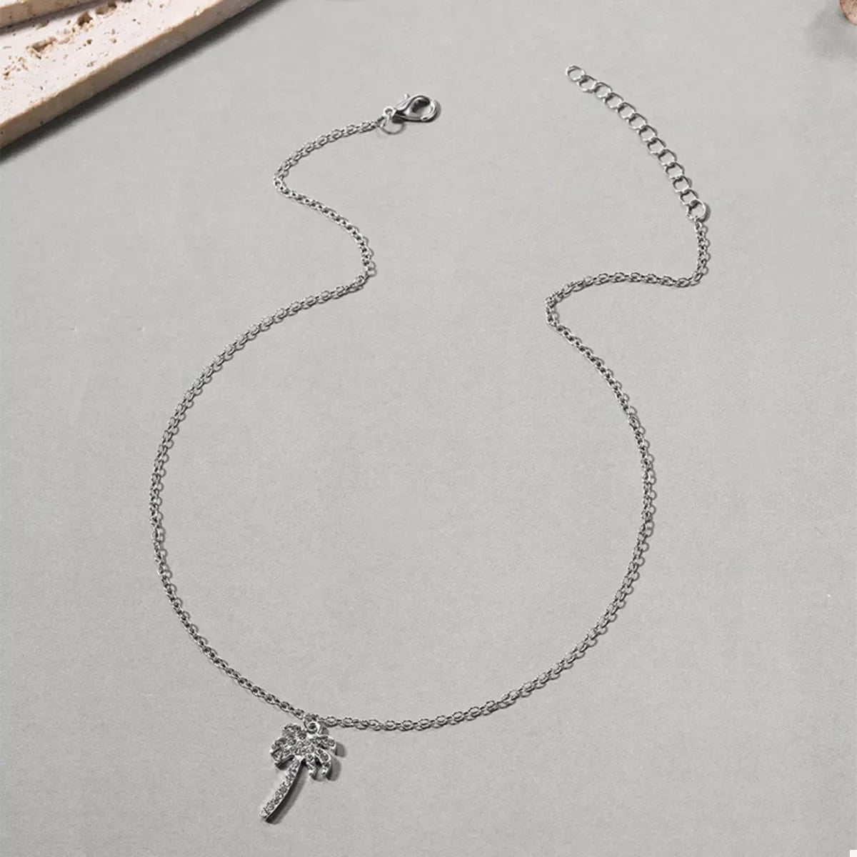 Silver palm tree pendant necklace with delicate chain, 18K gold-plated.