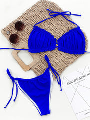 Royal blue bikini set with ruffled tie halter top and side tie bottoms.