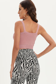 Pink ribbed knit crop top with square neckline and exposed zip detail.