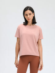 Relaxed fit performance tee in dusty rose pink with short sleeves and crew neck.