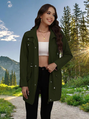 Military green drawstring trench coat with snap-down front and adjustable waist.