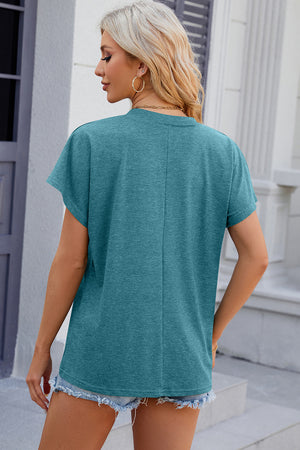 Turquoise dolman sleeve slouchy v-neck top with a relaxed fit.