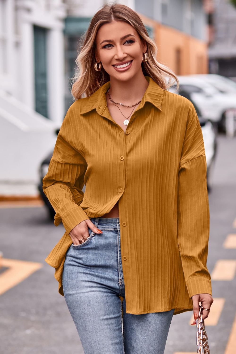 Textured oversized mustard yellow button-down shirt with a tie back detail.