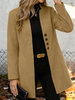Khaki longline trench coat with button-down front and collarless neckline.