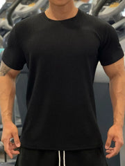 Black textured performance crew neck tee with short sleeves.