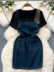 Black cotton tee with a blue denim overall dress featuring patch pockets and distressed details.