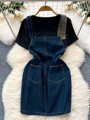 Black cotton tee with a blue denim overall dress featuring patch pockets and distressed details.