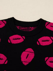 Black knit sweater with a playful pink football pattern and crew neck.
