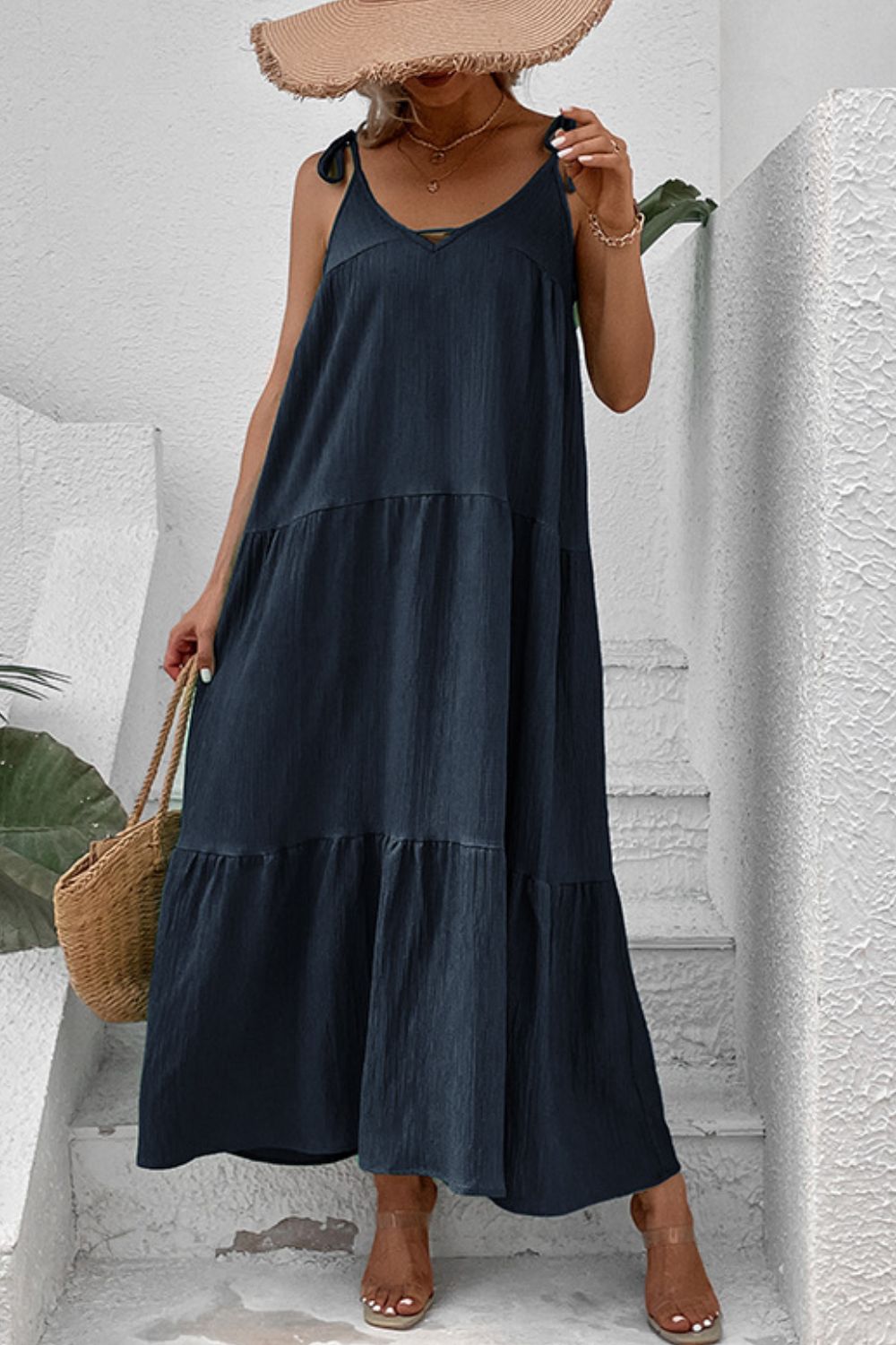 Dark blue tiered maxi dress with tie straps and textured fabric