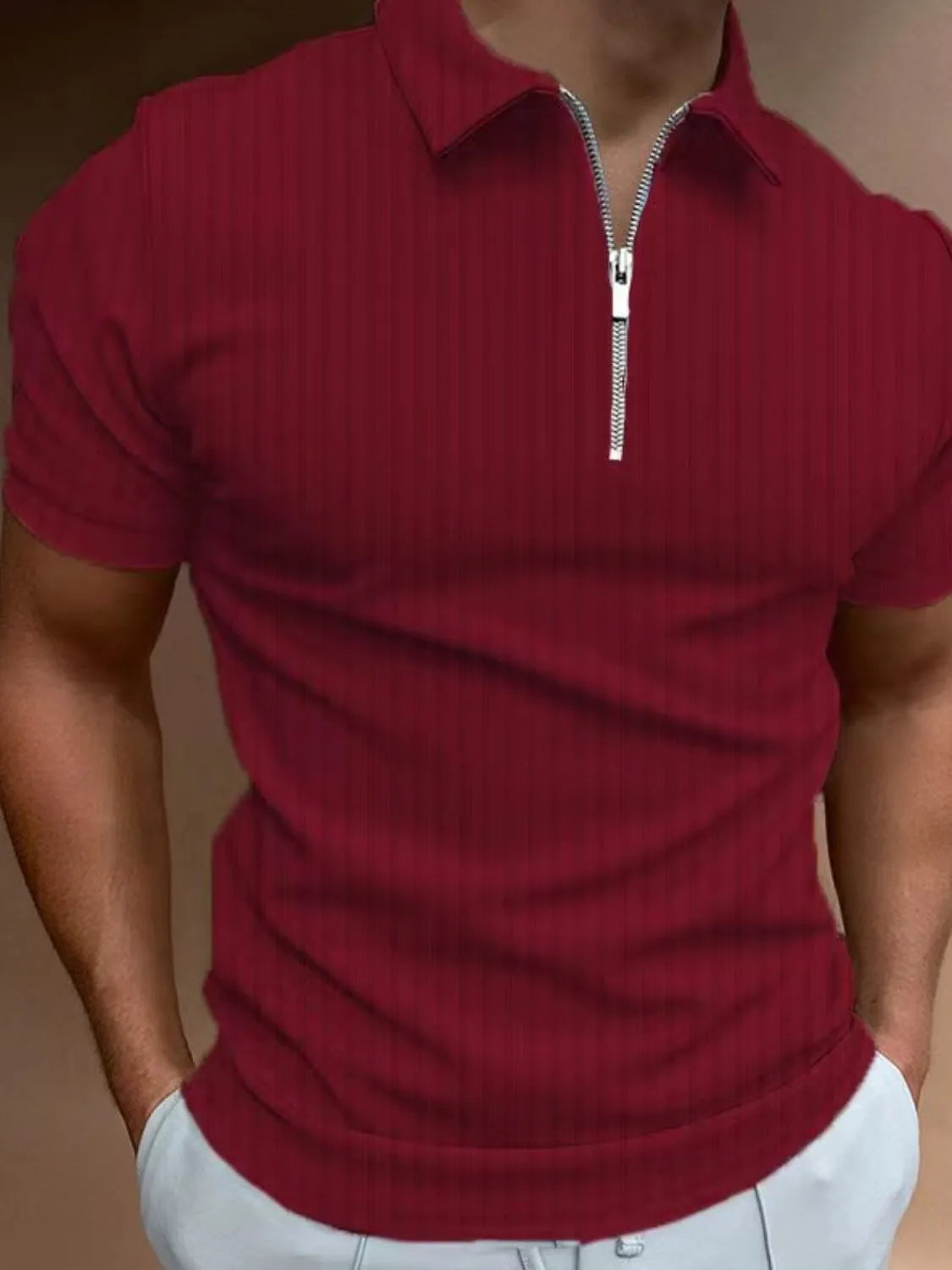 Burgundy ribbed zip-neck polo shirt with short sleeves and a silver zipper.