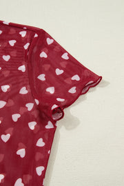 Deep Red sheer heart print t-shirt with lettuce edge sleeves.