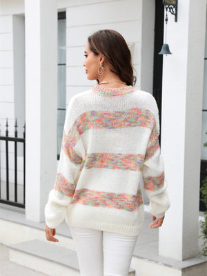 White acrylic slouchy knit sweater with rainbow stripes and crew neck.