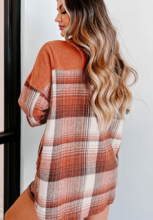 Colorblock plaid shacket in terracotta with contrast cuffs and sleeves.