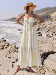 Cream ruched sweetheart neck maxi dress with crochet bodice and tassels.