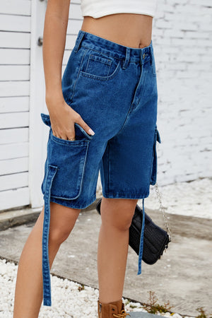 Medium blue denim cargo shorts with straps and utility pockets.