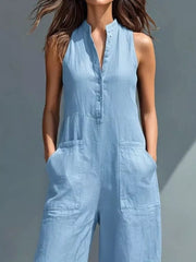 Sky blue sleeveless button-down romper with pockets and a collared neckline.