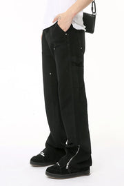 Black bootcut denim pants with zip hem detail and utility pockets.