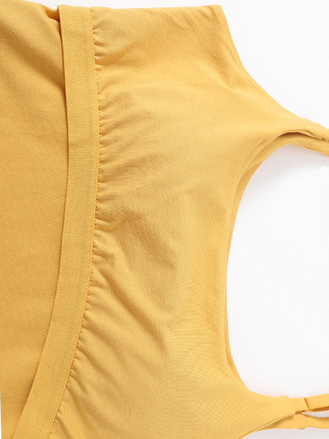 Mustard built-in bustier crop camisole with ruched detail and adjustable straps.