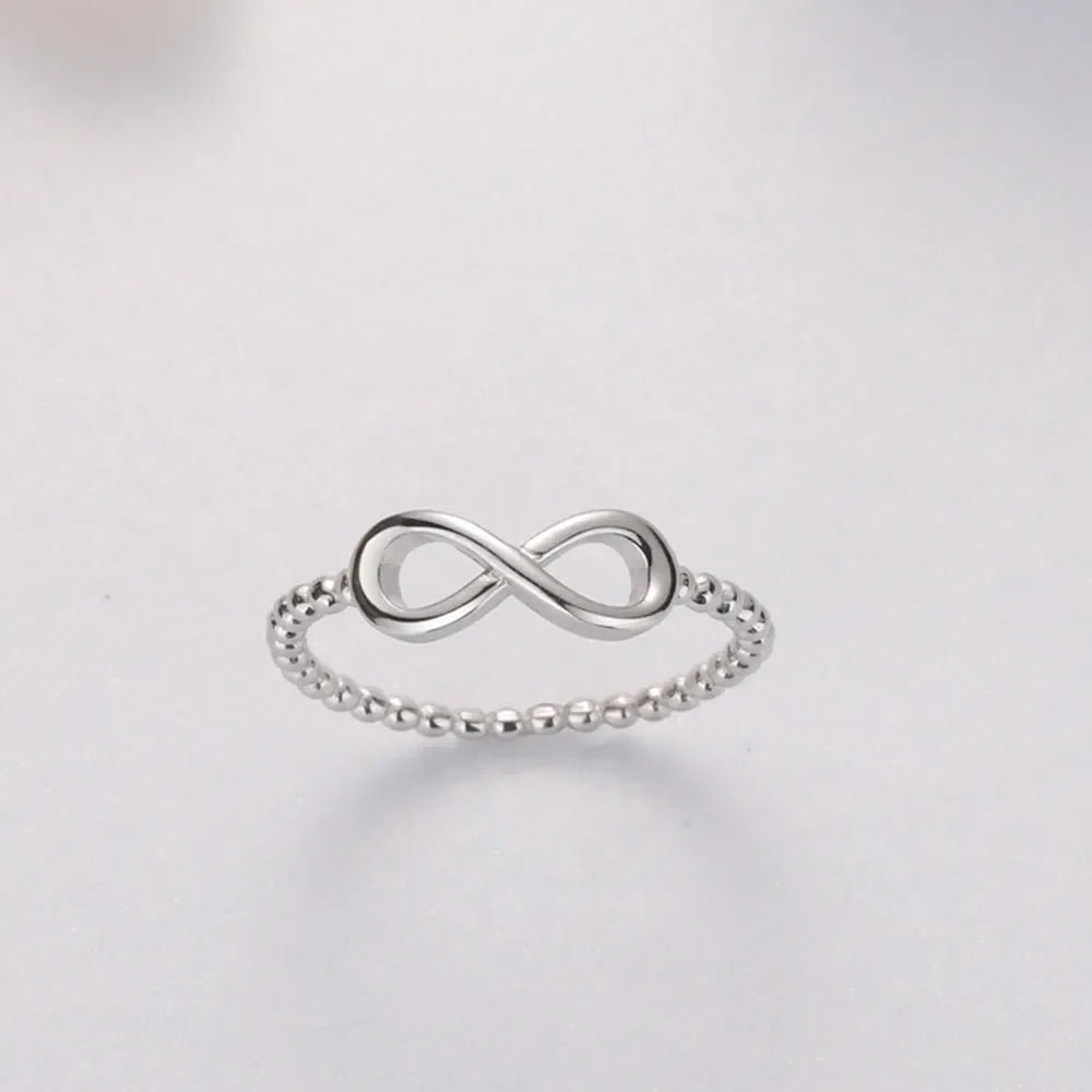 Sterling silver ring with infinity symbol and beaded band