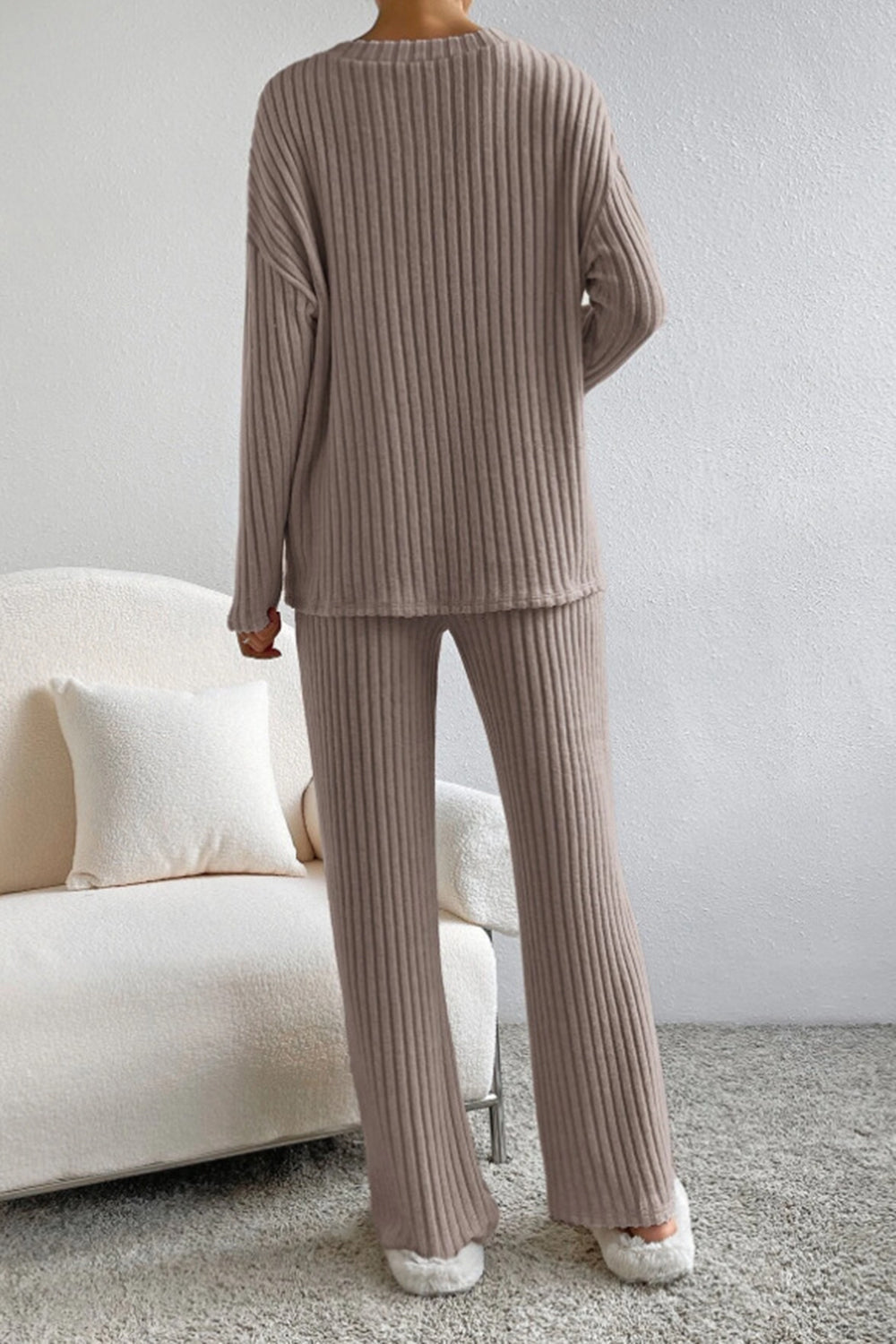Cozy ribbed knit lounge set in tan, featuring a long sleeve top and flared pants.