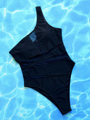 Black asymmetrical one-piece swimsuit with mesh panels and a high-cut leg.