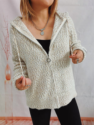Speckled knit relaxed zip-up hoodie in cream with a herringbone texture and silver zipper pull.