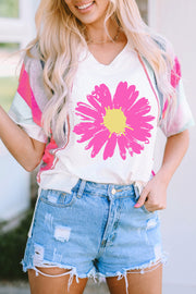 White t-shirt with large pink floral graphic and colorblock sleeves