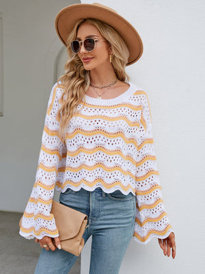Scalloped crochet crop sweater in white with yellow and orange stripes, featuring bell sleeves.