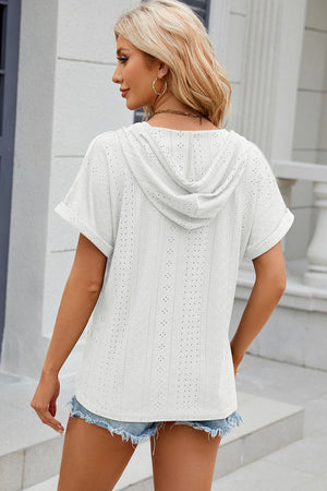 White perforated henley hooded tee with short sleeves and cuffed hems.