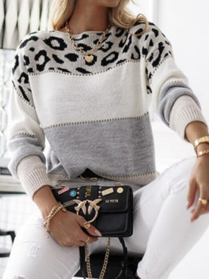 Leopard panel colorblock sweater with gray and white stripes.