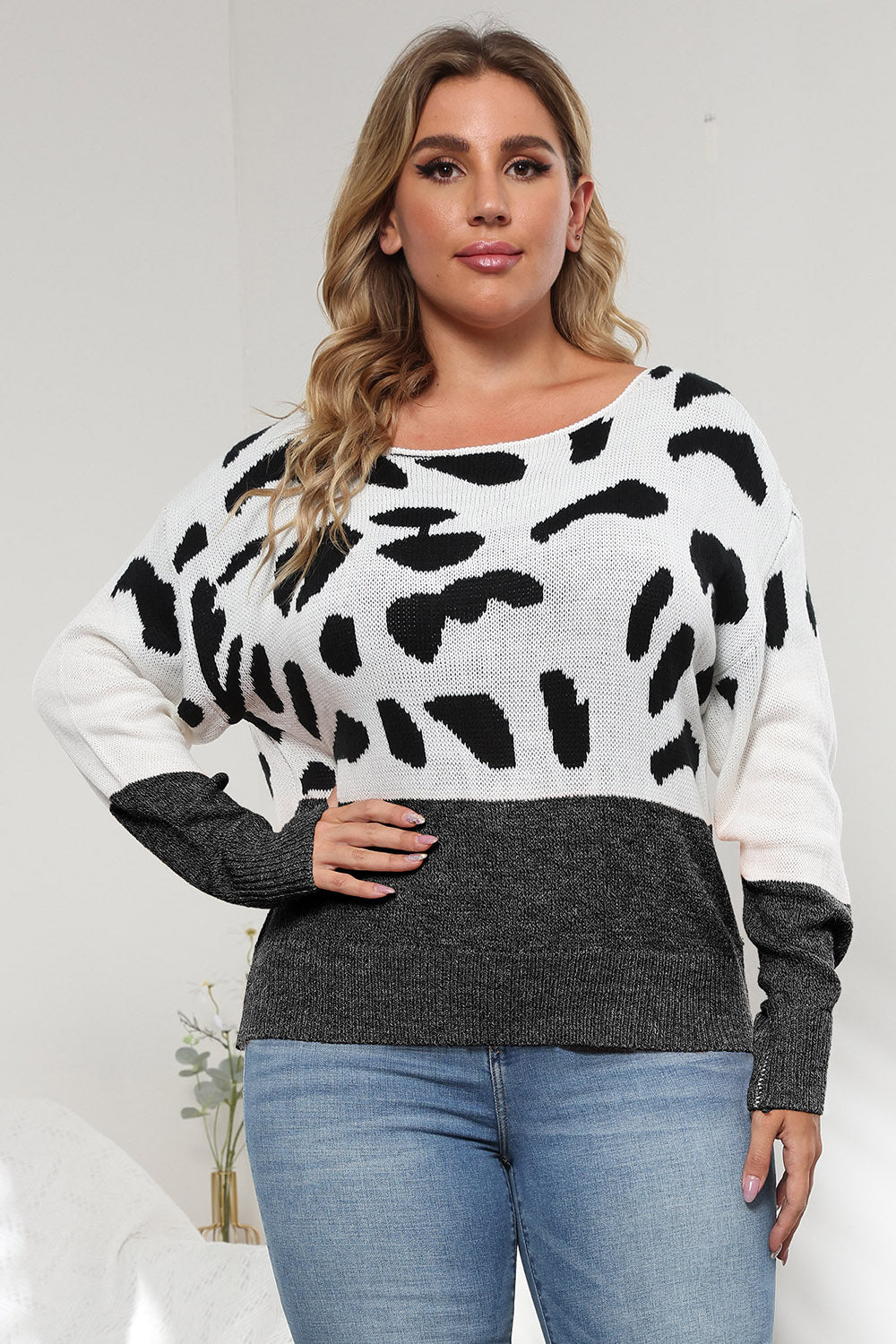 Dalmatian print colorblock knit sweater with crew neck and long sleeves.