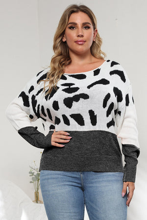 Dalmatian print colorblock knit sweater with crew neck and long sleeves.