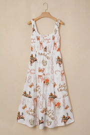 Cowboy Charm U-neck Midi Dress in white cotton blend with a playful cowboy print, smocked bodice, and tiered skirt.