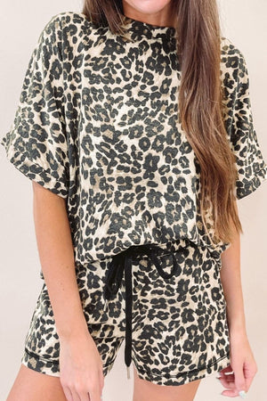 Relaxed leopard print loungewear set with short sleeves and drawstring shorts.