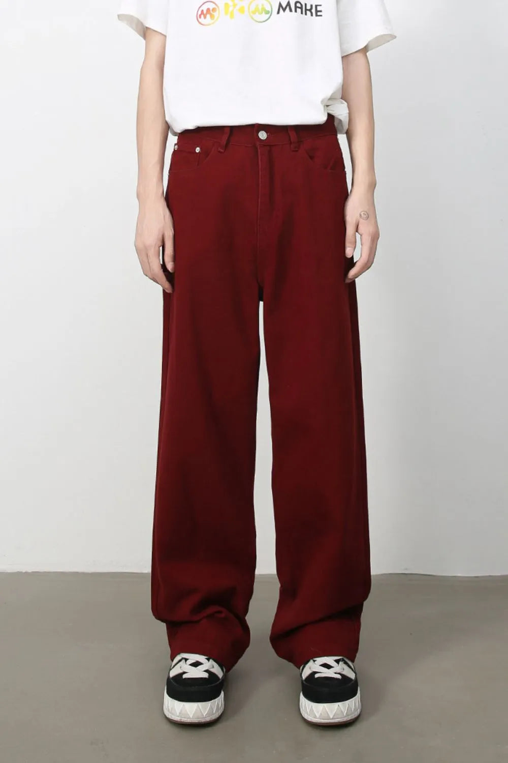 Burgundy wide-leg denim trousers with a relaxed fit.