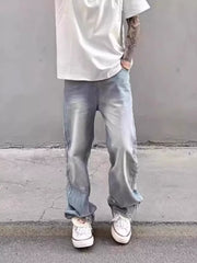 Relaxed fit light wash distressed wide leg jeans in cotton blend.