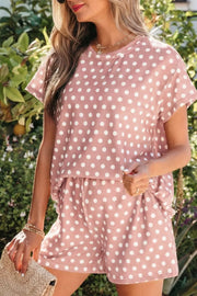 Polka dot tee and shorts set in pink polyester with white dots.