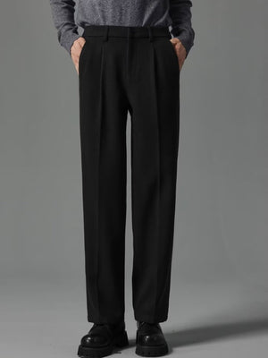 Men's black premium pocketed sweatpants with a relaxed fit and subtle pleats.