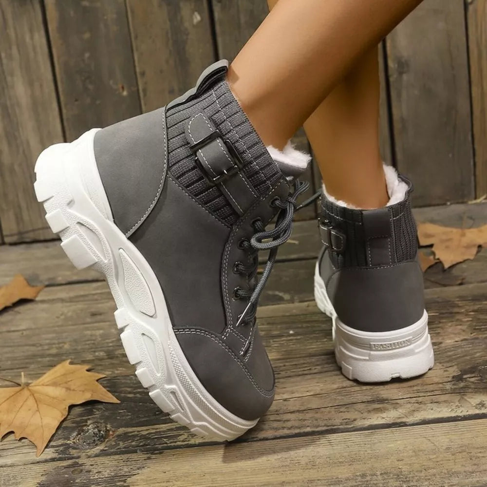 Dark gray lace-up boots with plush accents and buckle detail.