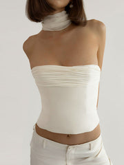 Cream ruched tube top with sheer scarf neck detail, cropped length.