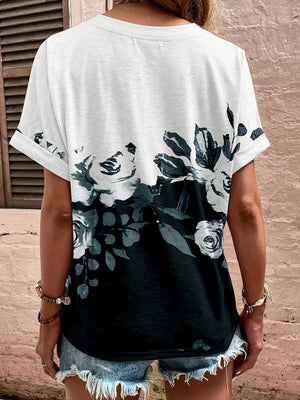 Bohemian tapestry blouse with a floral print, cuffed short sleeves, and a gradient black and white design.