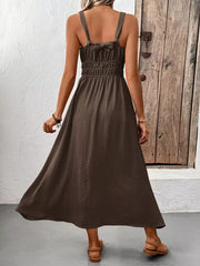 Coffee brown smocked midi dress with tie straps and a flowing skirt.