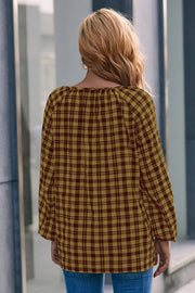 Gingham gathered neckline blouse in mustard and burgundy with balloon sleeves.
