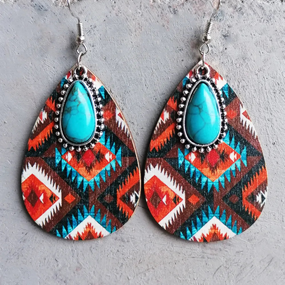 Geo-Turq teardrop dangle earrings with tribal pattern and turquoise stone.