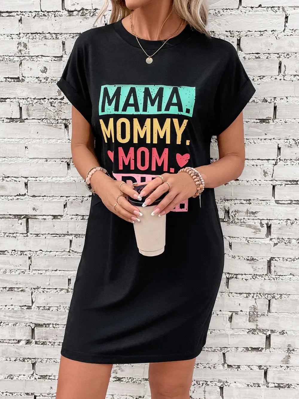 Black graphic tee dress with Mama Mommy Mom text, crew neck, short sleeves, and relaxed fit.